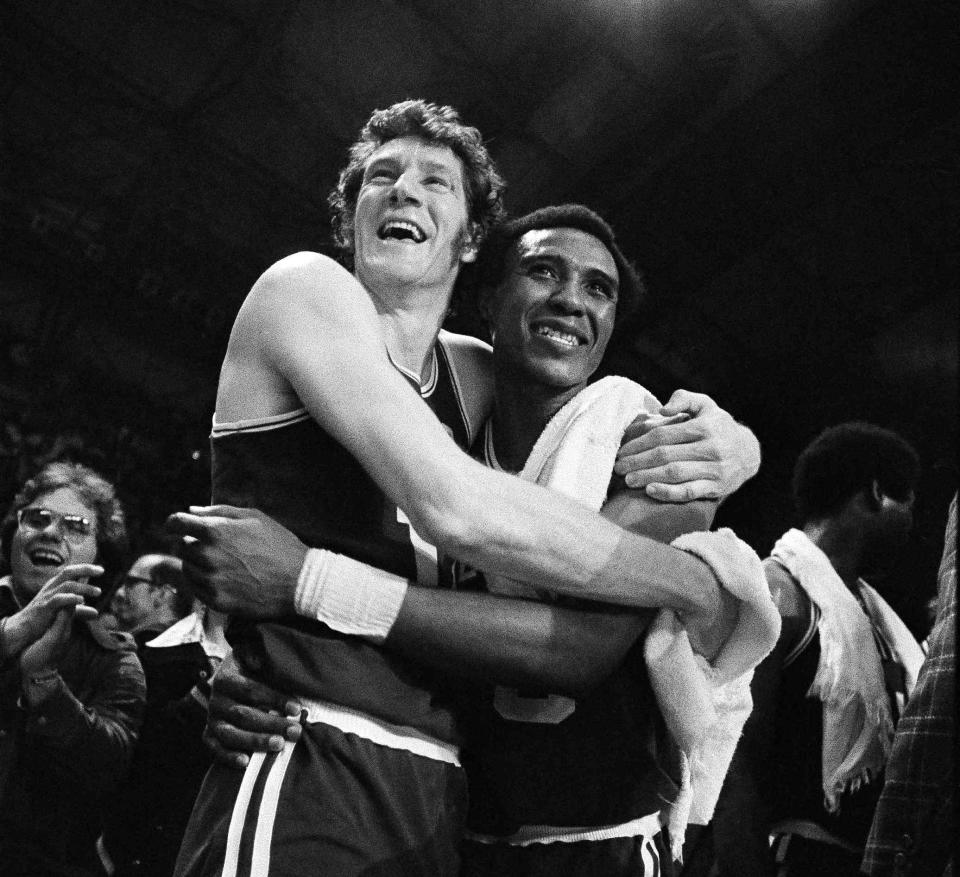 FILE - In this May 13, 1974, file photo, Boston Celtics' John Havlicek, left, and Jo-Jo White celebrate defeating the Milwaukee Bucks, 102-87 to win the NBA Championship, in Milwaukee, Wisc. The Celtics said Havlicek died Thursday, April 25, 2019, in Jupiter, Florida. He was 79. The cause of death wasn't immediately available. (AP Photo/File)