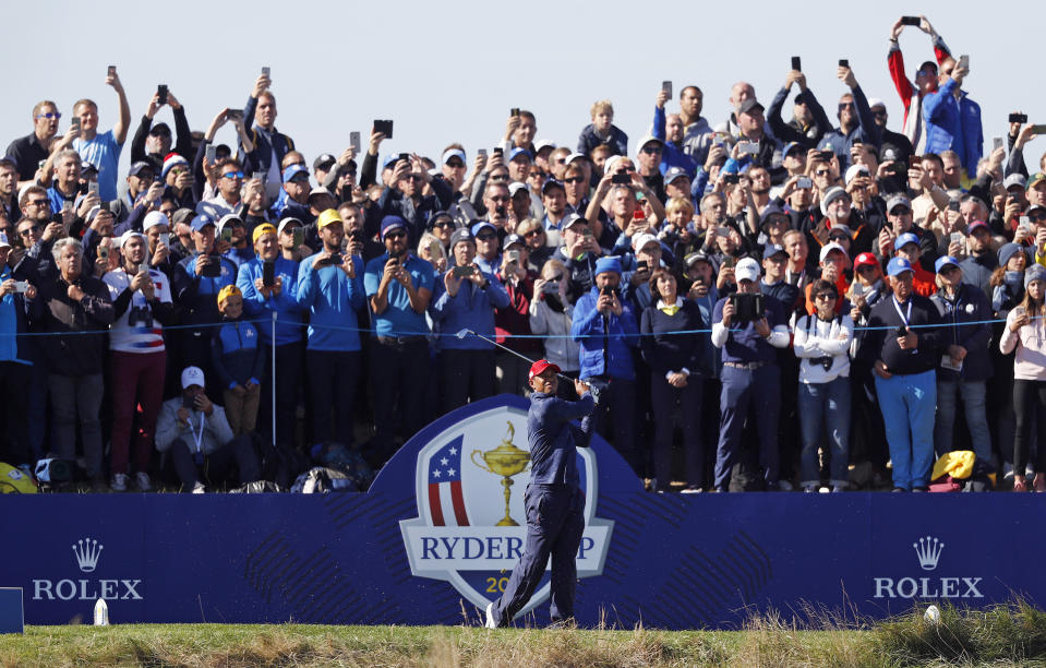 FILE - In a Sunday, Sept. 30, 2018 file photo, Tiger Woods plays a shot from the 4th tee during a singles match on the final day of the 42nd Ryder Cup at Le Golf National in Saint-Quentin-en-Yvelines, outside Paris, France. A decision is looming whether to play the Ryder Cup in Wisconsin in September 2020 with fans or even postpone it until next year. (AP Photo/Alastair Grant, File)