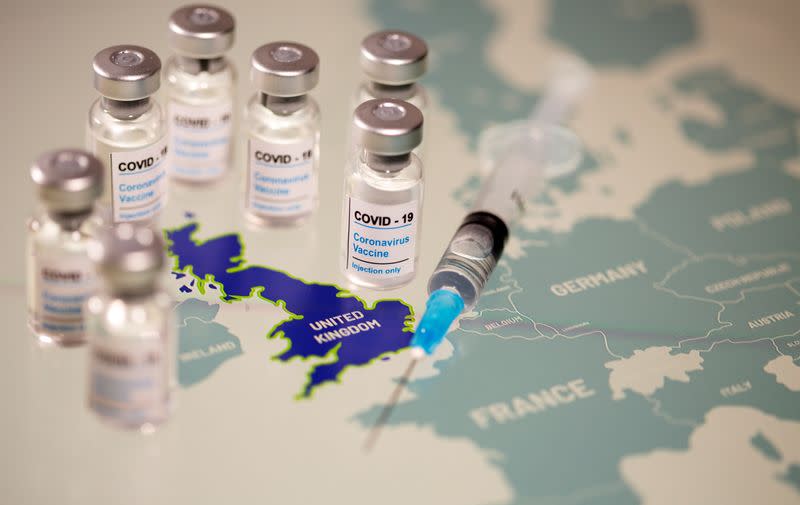 Vials labelled "COVID-19 Coronavirus-Vaccine" and medical syringe are placed on the European Union map in this picture illustration