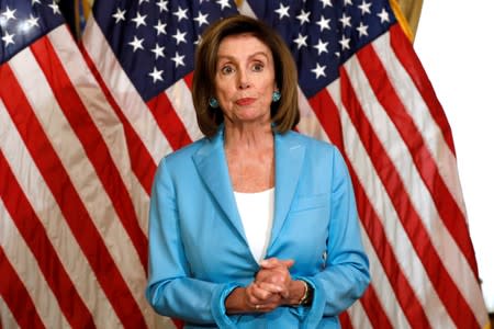 FILE PHOTO: House Speaker Nancy Pelosi with Chuck Schumer signs the Bipartisan Budget Act of 2019