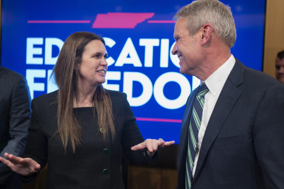 Arkansas Gov. Sarah Huckabee Sanders, left, speaks with Tennessee Gov. Bill Lee, right, after a news conference Tuesday, Nov. 28, 2023, in Nashville, Tenn. Gov. Lee presented the Education Freedom Scholarship Act of 2024, his administration's legislative proposal to establish statewide universal school choice. (AP Photo/George Walker IV)