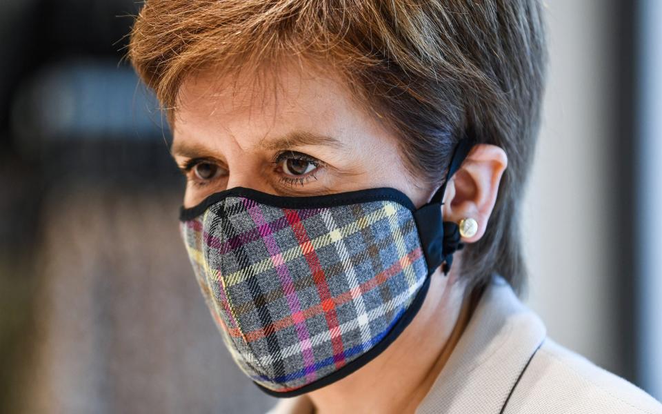 Nicola Sturgeon in a tartan face mask - Getty Images Europe