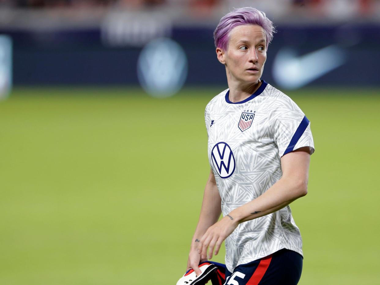 Megan Rapinoe warms up before USWNT match in June 2021.