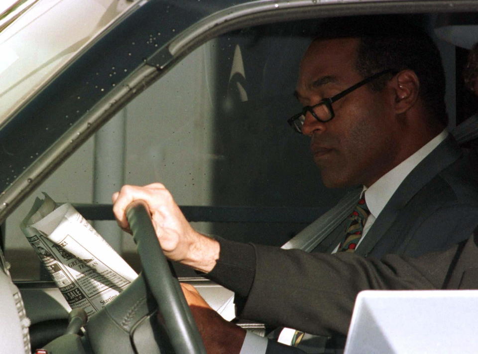 Defendant O.J. Simpson looks over the morning paper as is driven to his wrongful death civil trial at the Santa Monica Courthouse January 27. Jury deliberations are expected to begin late in the day in the suit filed by the families of murder victims Ronald Goldman and Nicole Brown Simpson.

USA SIMPSON