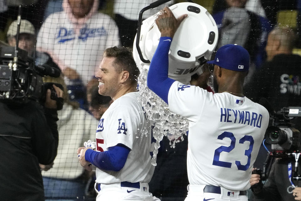 Los Angeles Dodgers' Jason Heyward, right, dumps liquid on Freddie Freeman after Freeman hit a walk-off single during the 11th inning of a baseball game against the Chicago White Sox Thursday, June 15, 2023, in Los Angeles. The Dodgers won 5-4. (AP Photo/Mark J. Terrill)