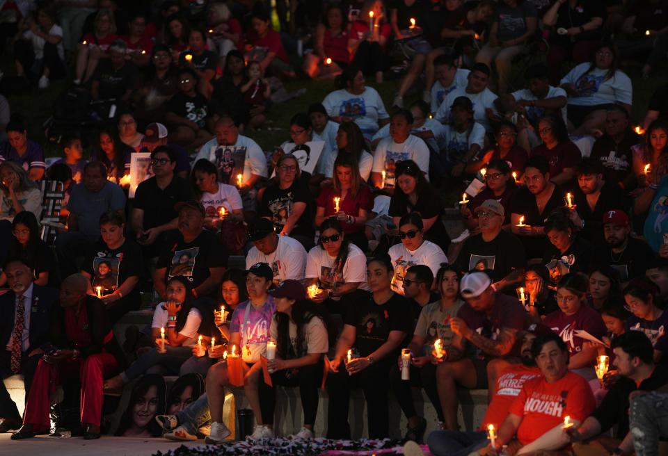 People mourn the victims of the Robb Elementary School shooting at a candlelight vigil in Uvalde on May 24 marking the first anniversary of the attack. A Travis County judge has issued an order this week for the Texas Department of Public Safety to release a trove of investigative information and evidence from the 2022 mass shooting.