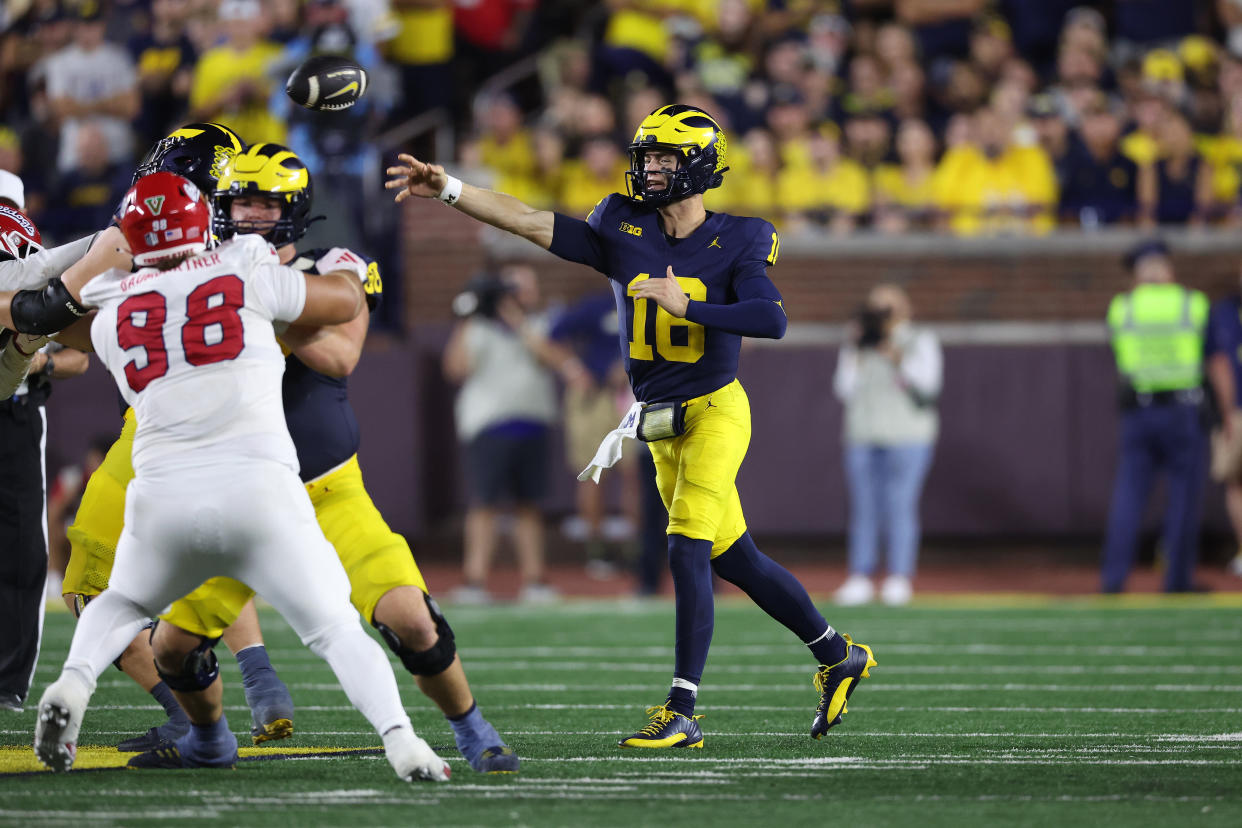 ANN ARBOR, MICHIGAN - AUGUST 31: Davis Warren #16 of the Michigan Wolverines throws a second half pass while playing the Fresno State Bulldogs at Michigan Stadium on August 31, 2024 in Ann Arbor, Michigan.  (Photo by Gregory Shamus/Getty Images)