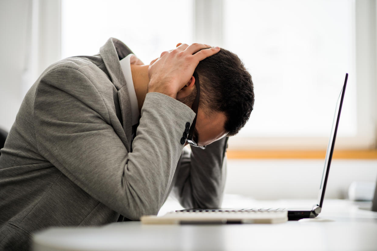 Young businessman is tired of overwork. He is depressed.