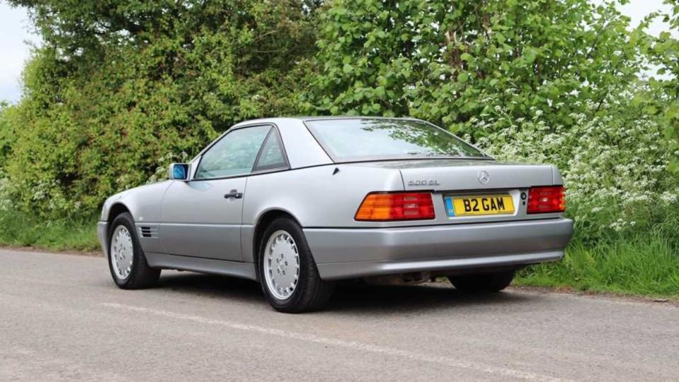 a silver car parked on a road