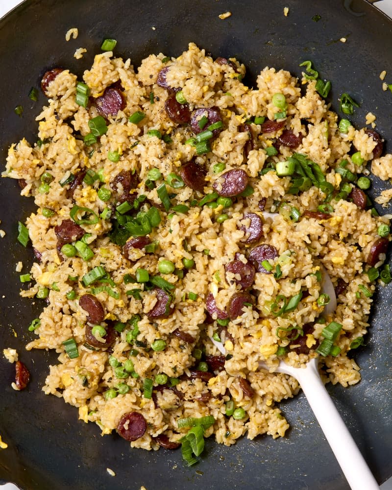 Overhead shot of Chinese sausage fried rice in a wok.