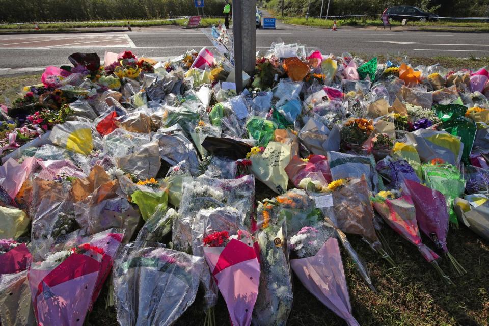 Tributes near the scene where Pc Harper died (PA)
