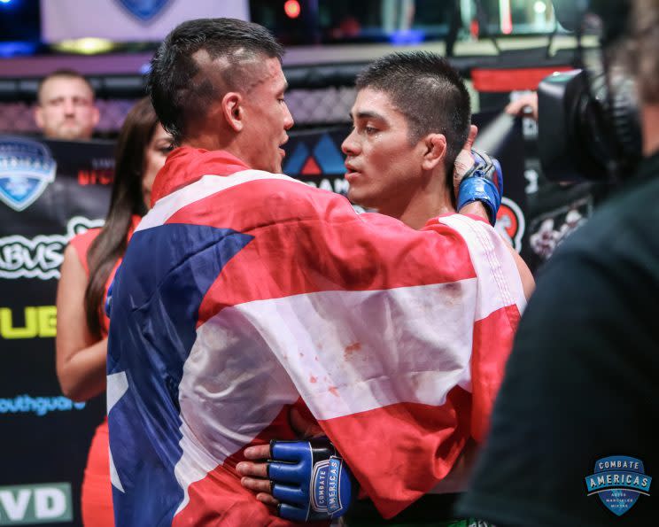 John Castaneda, left, embraces Angel Cruz after their bout. (Courtesy of Combate Americas)