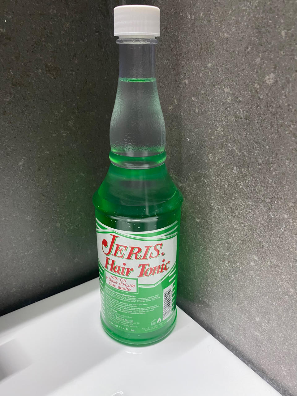 jeris hair tonic bottle on a bathroom sink