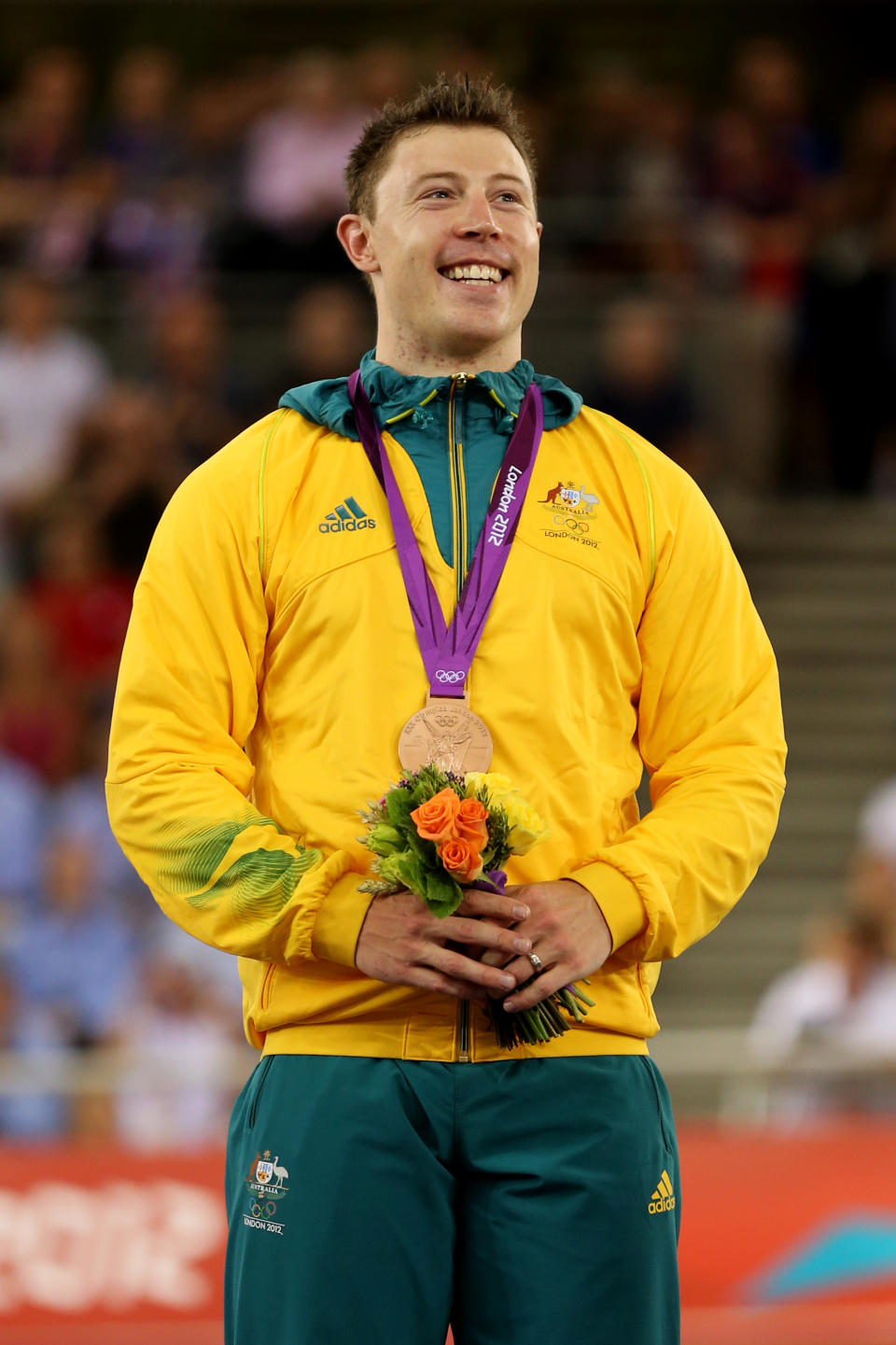 LONDON, ENGLAND - AUGUST 06: Bronze medallist Shane Perkins of Australia celebrates during the medal ceremony for the Men's Sprint Track Cycling Final on Day 10 of the London 2012 Olympic Games at Velodrome on August 6, 2012 in London, England. (Photo by Bryn Lennon/Getty Images)