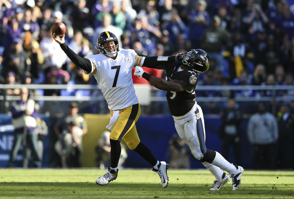 <p>Pittsburgh Steelers quarterback Ben Roethlisberger (7) throws a pass as he tries to avoid Baltimore Ravens outside linebacker Matt Judon in the first half of an NFL football game, Sunday, Nov. 4, 2018, in Baltimore. (AP Photo/Gail Burton) </p>