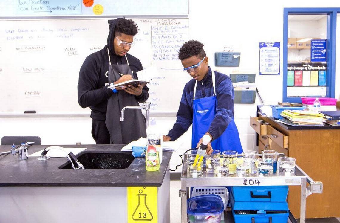 Lamarius Green, left, and Alazar Mebrahtu complete an experiment during an International Baccalaureate level chemistry class at Hillside High School in 2018.,