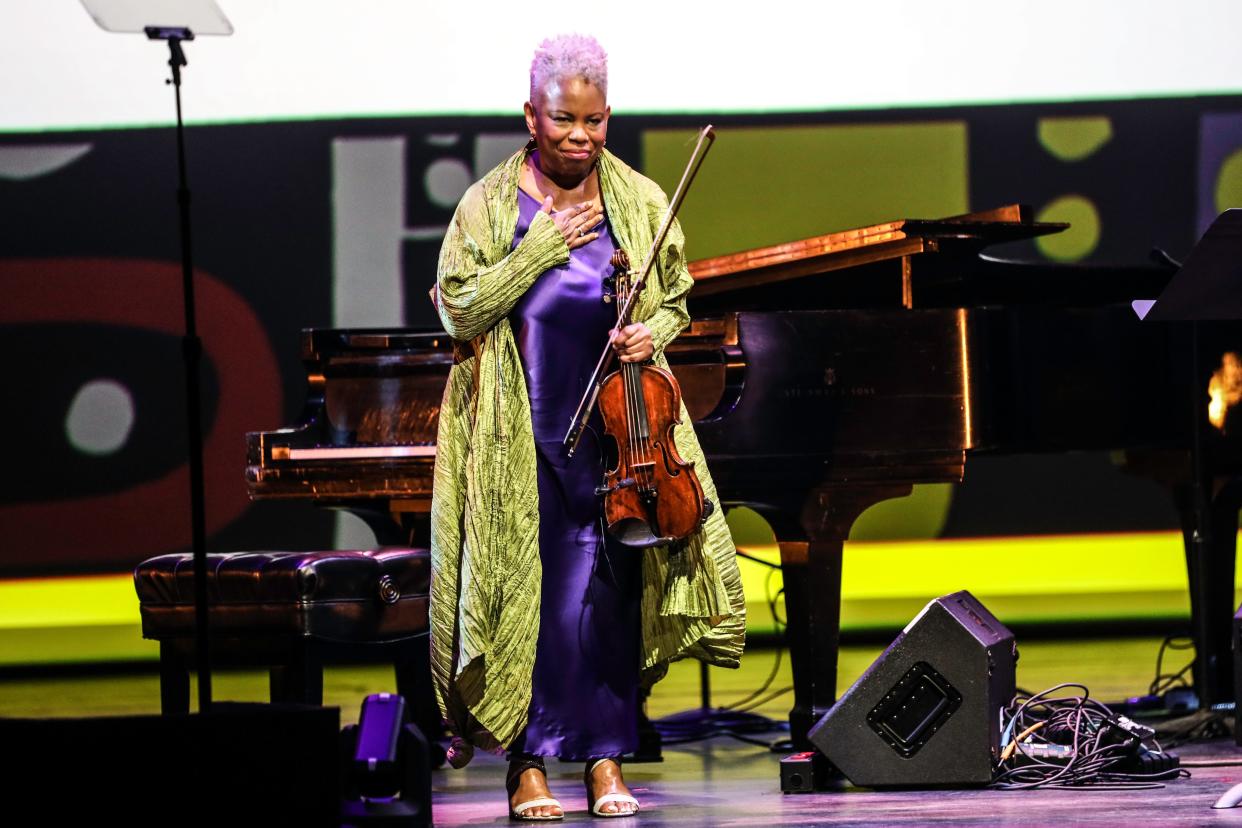 Detroit-born violinist Regina Carter takes a bow while being celebrated as one of 2023's National Endowment for the Arts' Jazz Masters at Washington, D.C.'s Kennedy Center on April 1, 2023.