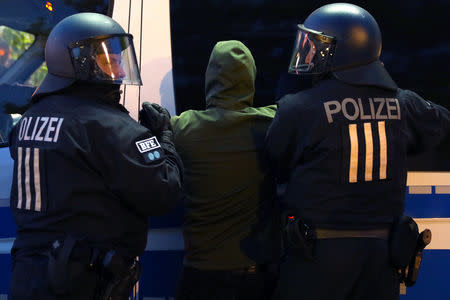 Police detain a protester during a left wing May Day demonstration in Berlin, Germany, May 1, 2019. REUTERS/Christian Mang