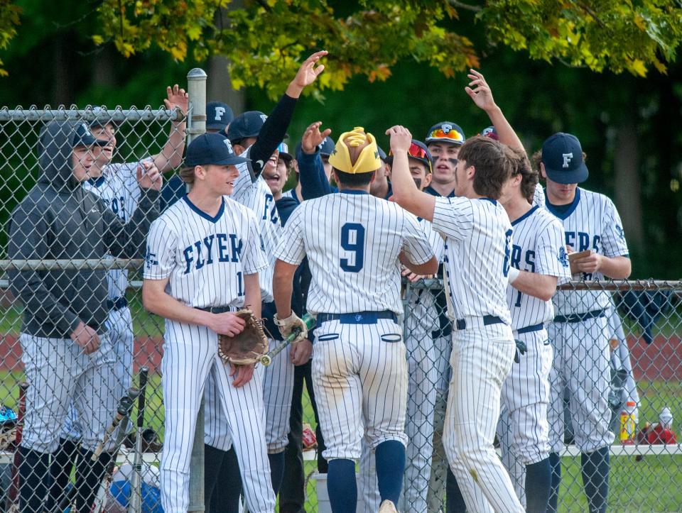 The Framingham High School baseball team celebrates early runs in the first Paul "Bunkie" Smith Memorial game between Framingham High School and Natick High School, May 13, 2024. Smith, a former coach and player, died Sept. 24, 2023.