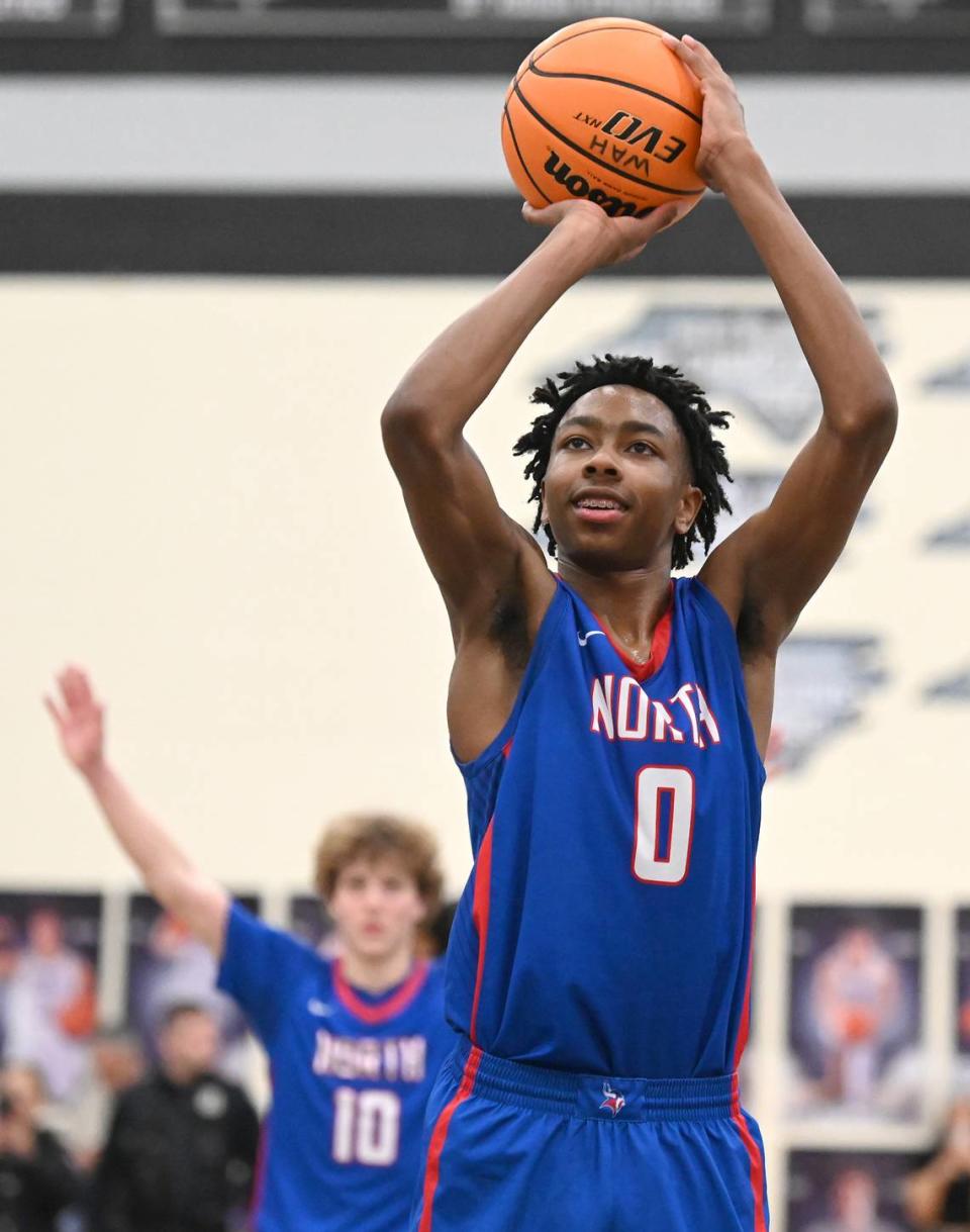 North Meck’s Isaiah Evans smiles as he prepares to sink a second free throw in the closing seconds of action against Chambers on Friday, February 17, 2023. North Meck defeated Chambers to win the Queen City boys conference championship at Hough High School in Huntersville, NC.