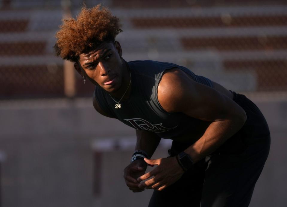Santana Wilson practices with his teammates at the Desert Mountain High football field in Scottsdale on May 3, 2023.