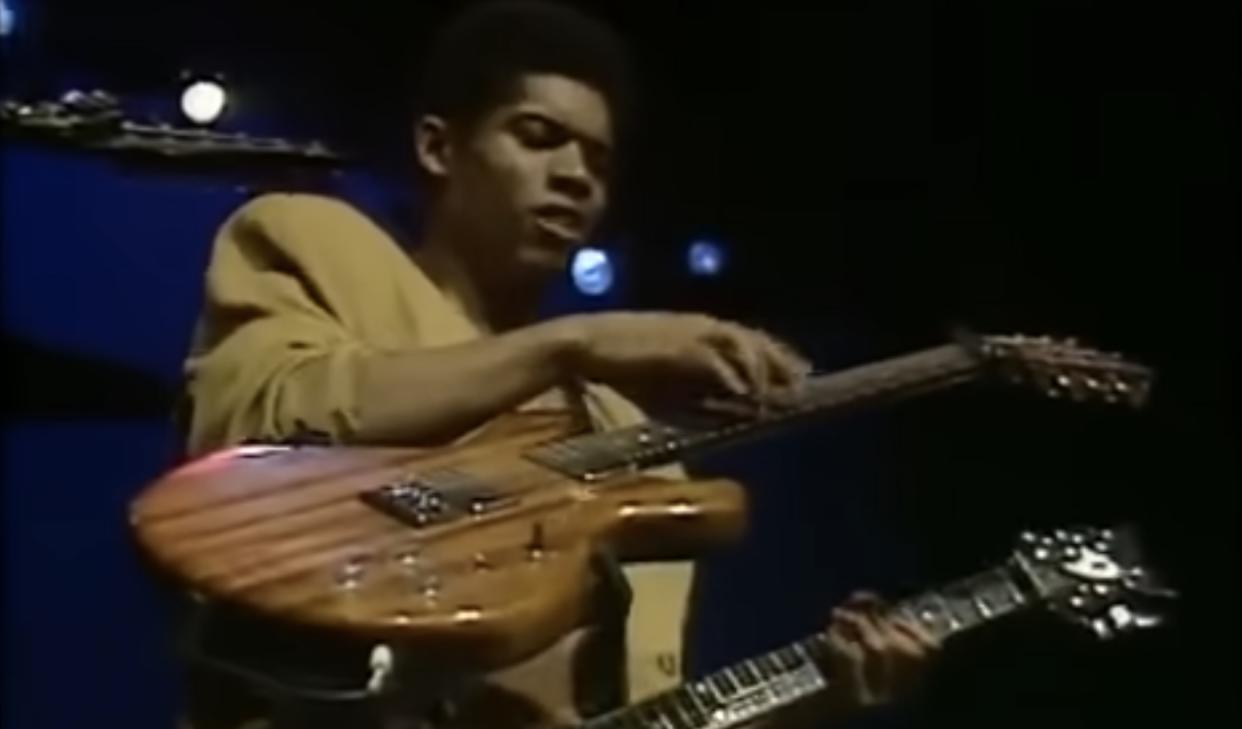  Stanley Jordan performs onstage, with two guitars 