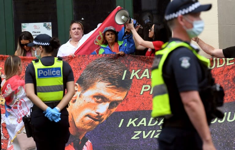 Protesters gathered at a Melbourne detention centre reportedly holding tennis champion Novak Djokovic (AFP/William WEST)