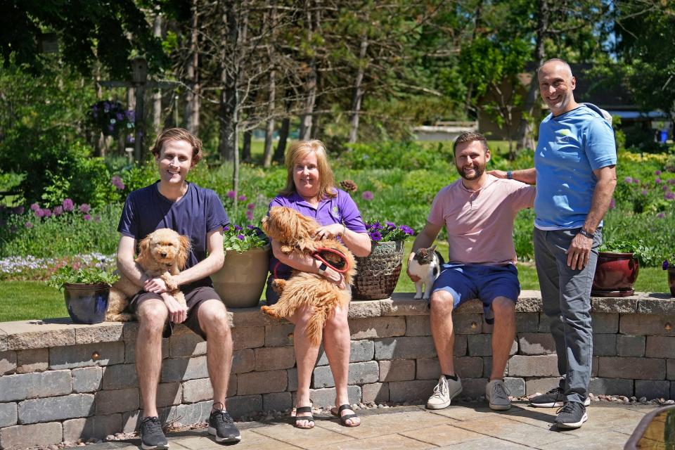 The  Palmisano family, from left, son Matthew with his dog Maui, his mother Kathie with the family dog Elly, son Paul with the family cat Bella, and dad Casey pictured on  May 26, 2023 at the family home in Muskego.