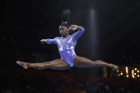 Gold medalist Simone Biles of the United States performs on the balance beam in the women's apparatus finals at the Gymnastics World Championships in Stuttgart, Germany, Sunday, Oct. 13, 2019. (AP Photo/Matthias Schrader)