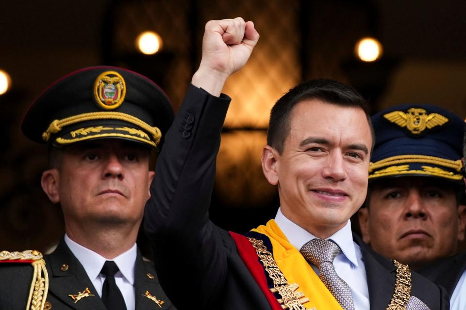 Newly sworn-in President Daniel Noboa waves from a balcony of the Carondelet presidential palace in Quito, Ecuador, on Nov. 23, 2023.