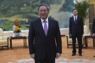 Chinese Premier Li Qiang, left, waits for the arrival of U.S. Treasury Secretary Janet Yellen, unseen for a meeting at the Great Hall of the People in Beijing, China, Sunday, April 7, 2024. Yellen, who arrived later in Beijing after starting her five-day visit in one of China's major industrial and export hubs, said the talks would create a structure to hear each other's views and try to address American concerns about manufacturing overcapacity in China. (AP Photo/Tatan Syuflana, Pool)