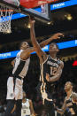 Atlanta Hawks forward De'Andre Hunter (12) shoots past Los Angeles Clippers guard Rodney McGruder (19) in the first half of an NBA basketball game Wednesday, Jan. 22, 2020, in Atlanta, Ga. (AP Photo/Brett Davis)