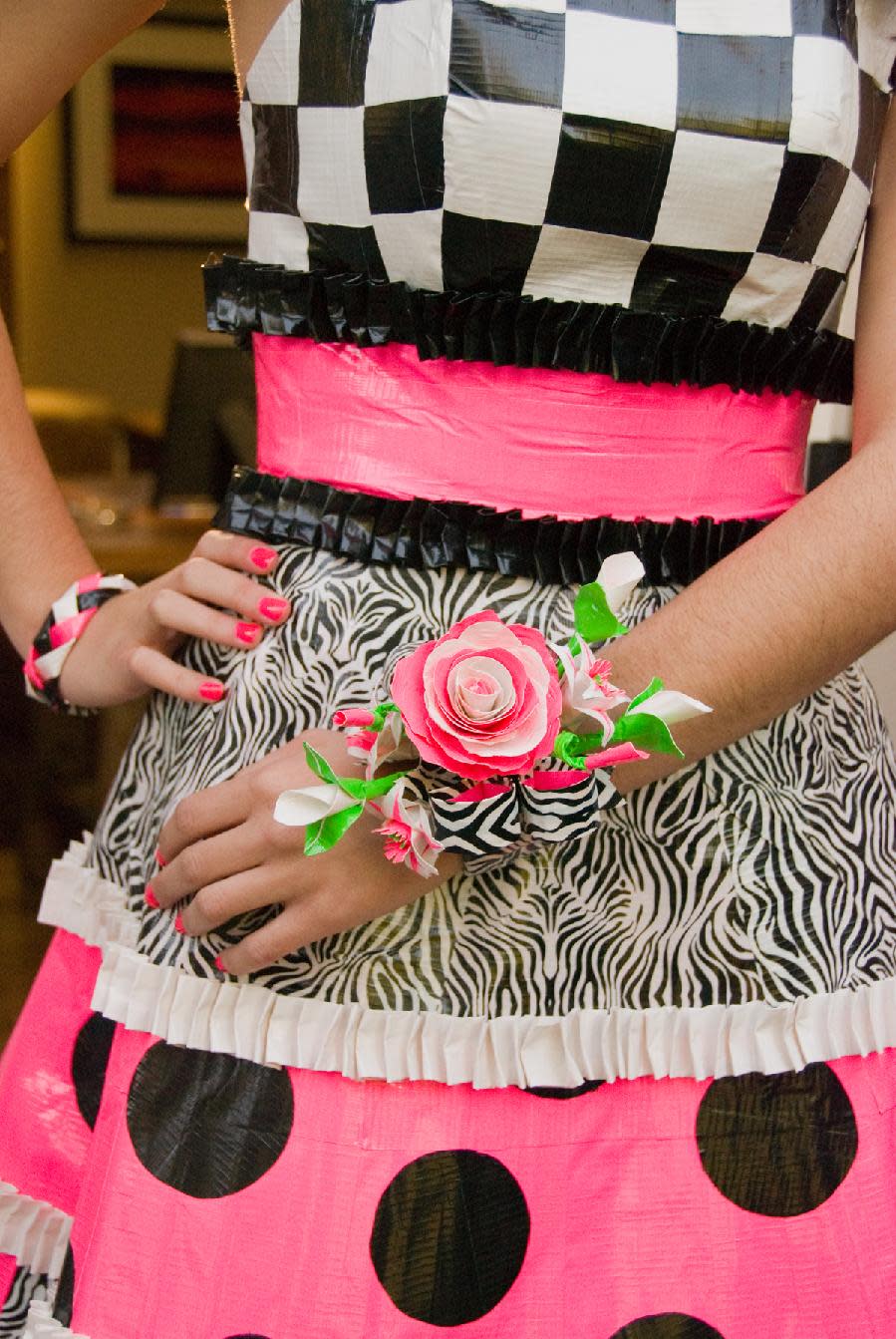 In this 2011 image released by ShurTech Brands, LLC, a duct tape corsage, part of a suit-and-dress ensemble that took a combined 29 rolls of tape and 58 hours to make, is shown. The arrangement won an Honorable Mention prize as Best Corsage in the Duck brand 2011 Stuck at Prom Scholarship Contest. (AP Photo/ShurTech Brands, LLC, Allison Rogers and David Bayless)