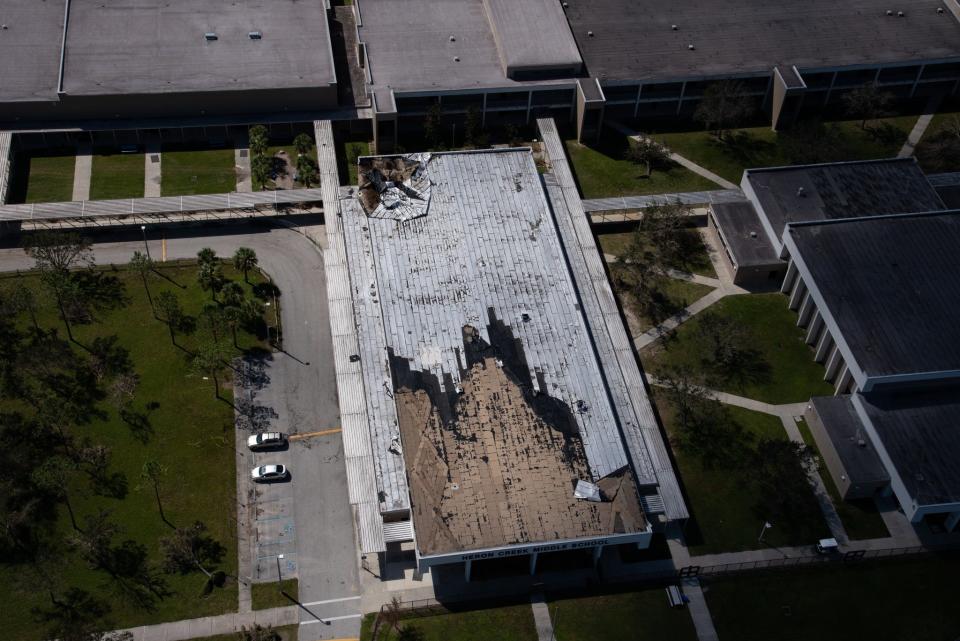Drone shot of roof damage to Heron Creek Middle School from Hurricane Ian.