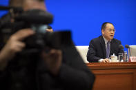 Tian Peiyan, deputy director of the Policy Research Office of the Central Committee of China's Communist Party, speaks during a press conference at the State Council Information Office in Beijing, Saturday, Dec. 4, 2021. China's Communist Party took American democracy to task on Saturday, sharply criticizing a global democracy summit being hosted by President Joe Biden next week and extolling the virtues of its governing system. (AP Photo/Mark Schiefelbein)