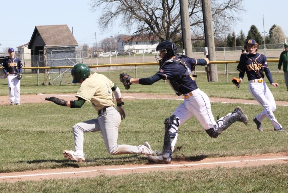 Erie Mason catcher Cole Kreger runs down St. Mary Catholic Central baserunner Drew Bylow during a 14-2 SMCC victory on Saturday, April 13, 2024.