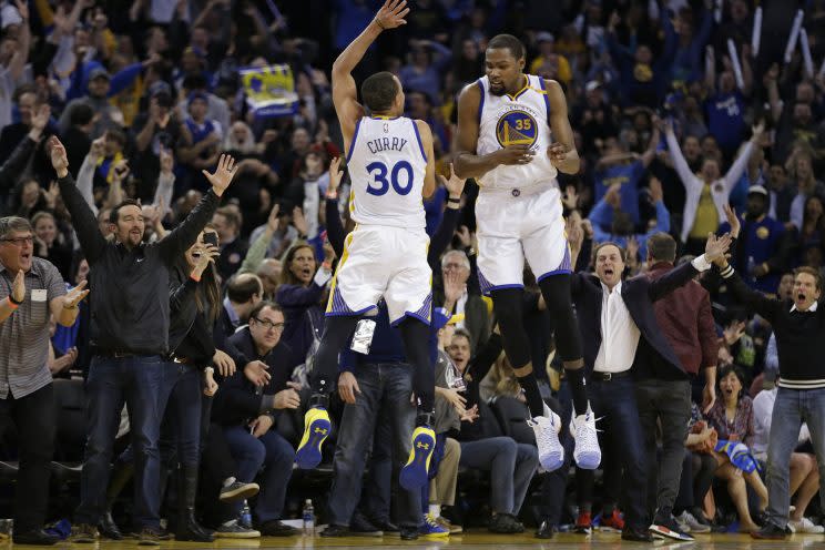 Stephen Curry and Kevin Durant celebrate being better than the Clippers. (AP)