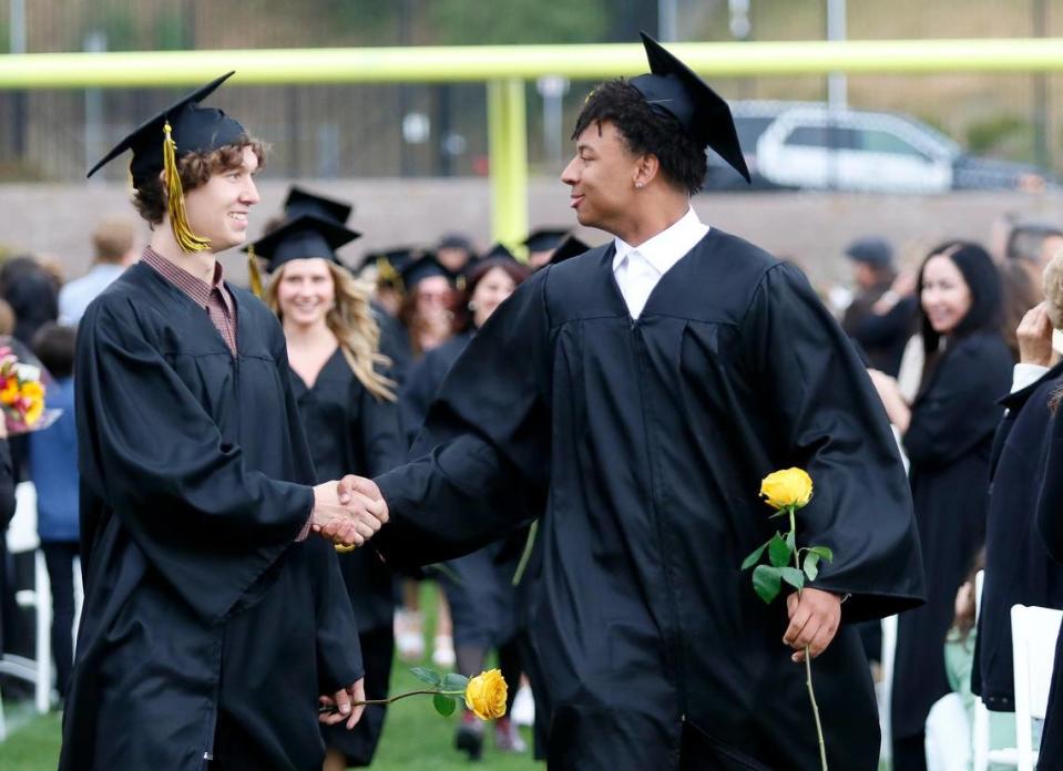 Students formed two lines and gave each other high-fives and fist bumps when they parted. San Luis Obispo High School celebrated its 389 graduating seniors in a ceremony at Holt Stadium on Friday evening, June 9, 2023.