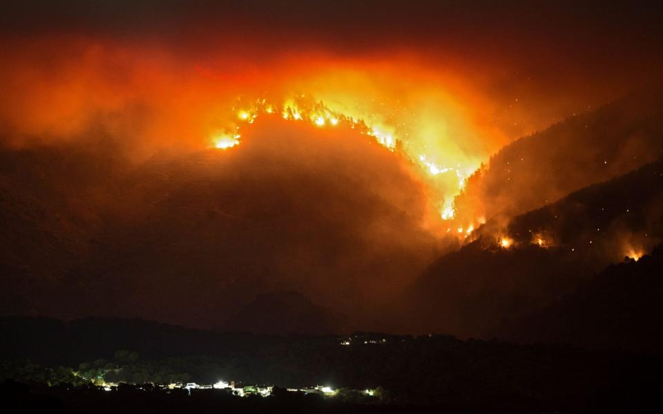 A picture taken from the village of Atajate, showing the wild fires last night - AFP