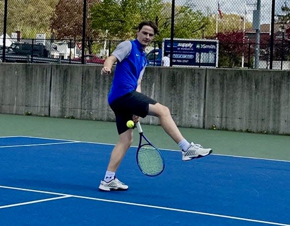 Auburn's Michael Fortunato goes between his legs to return a shot for the Rockets.