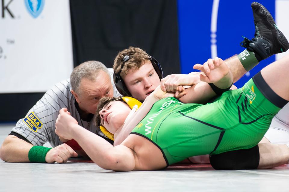 Faith Christian freshman Cael Weidemoyer (back) notched a pin in his first-round match Thursday at 152 pounds to advance to Friday's quarterfinals at the PIAA championships in Hershey.