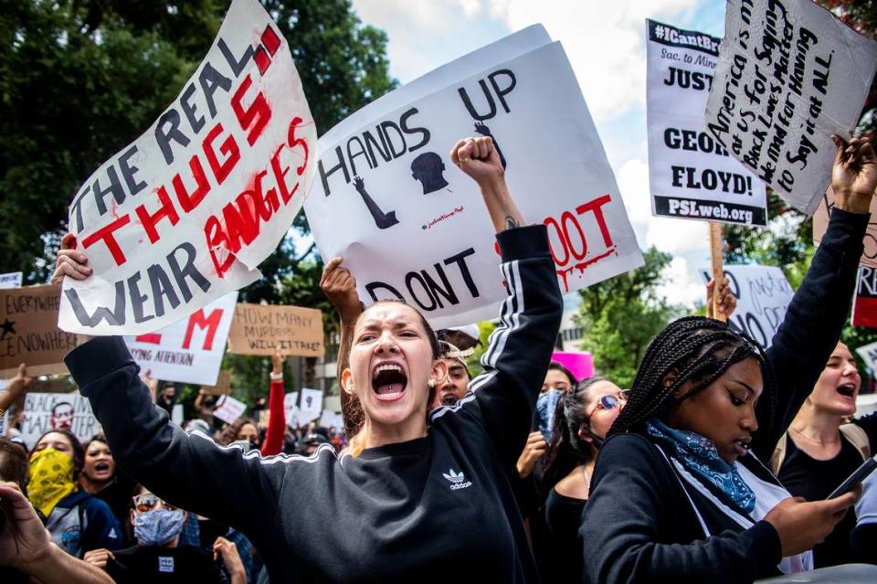 Protesters yell in unison in reaction to the death of Minneapolis man George Floyd on the south side of the Capitol in downtown Sacramento, Saturday, May 30, 2020.