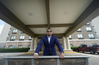 Vimal Patel president of Q Hotels, poses for a photograph at his Holiday Inn Express Hotel in LaPlace, La., Wednesday, June 23, 2021. (AP Photo/Gerald Herbert)