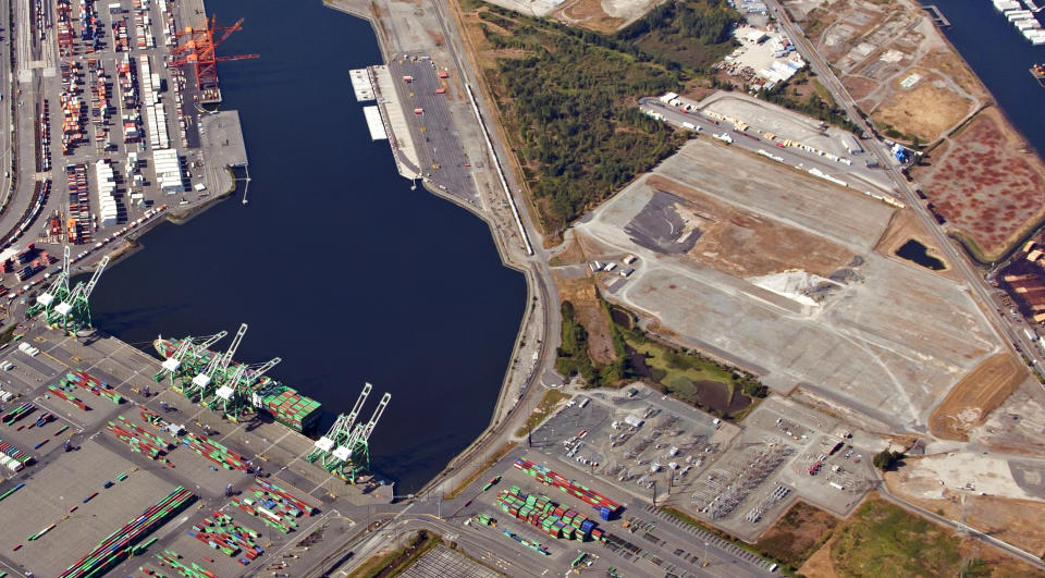 FILE - This Sept. 5, 2012, aerial photo provided by the Port of Tacoma shows the site of a proposed methanol plant at the Port of Tacoma, seen at right in Tacoma, Wash. A new federal lawsuit filed Tuesday, Nov. 12, 2019, aims to kill plans to build one of the world's biggest methanol refineries along the Columbia River. (Port of Tacoma via AP, File)