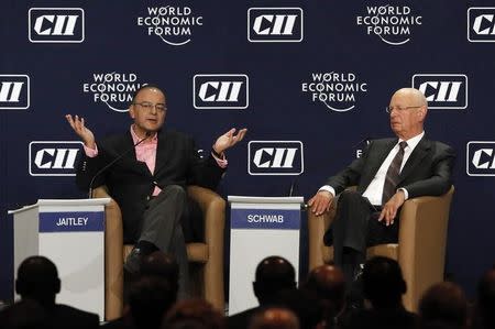 India's Finance Minister Arun Jaitley (L) speaks as World Economic Forum founder and executive chairman Klaus Schwab watches during the India Economic Summit 2014 at the World Economic Forum in New Delhi November 5, 2014. REUTERS/Anindito Mukherjee