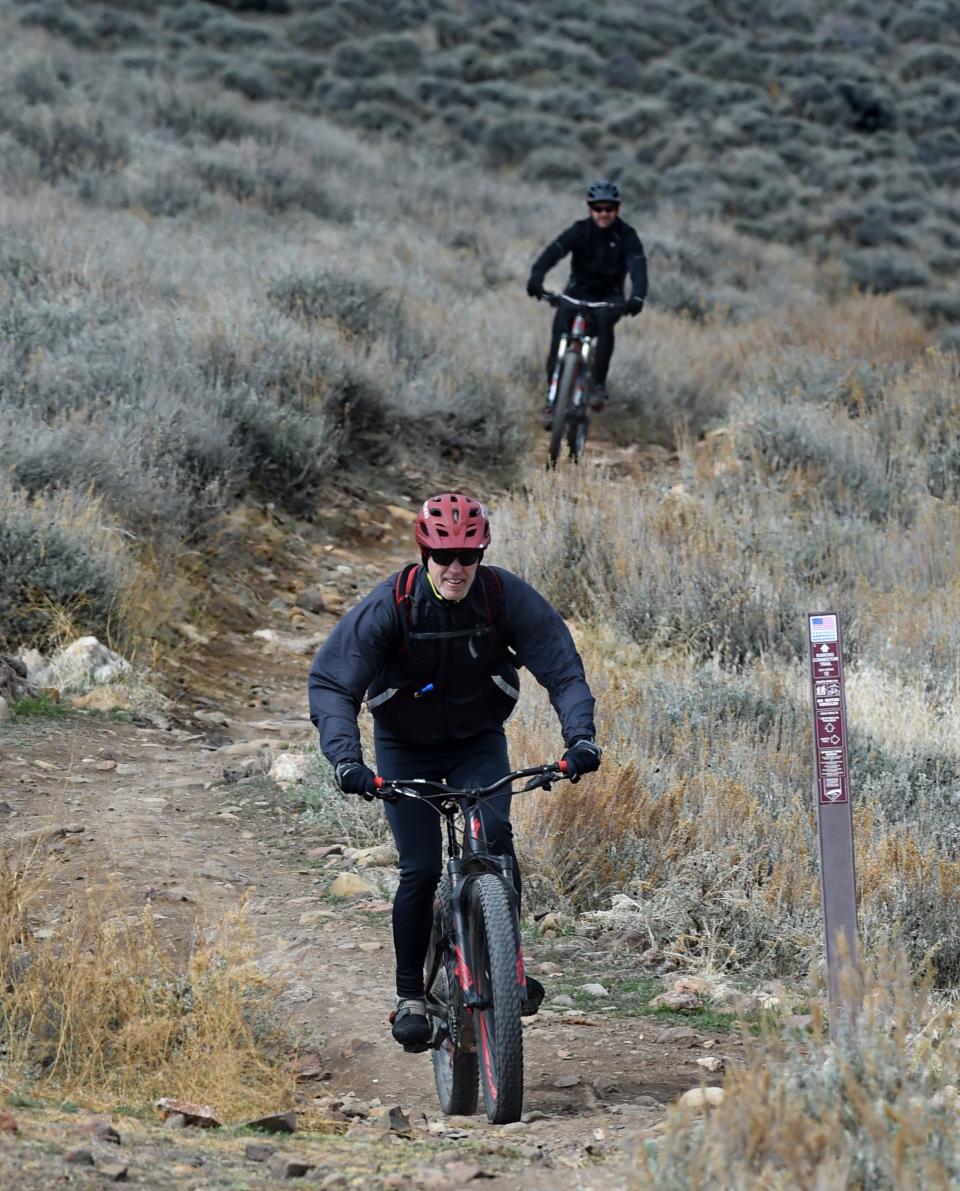 Mountain bike riders ride along the Rancho Connector Trail in the Evans Canyon on Sunday morning March 29, 2020.