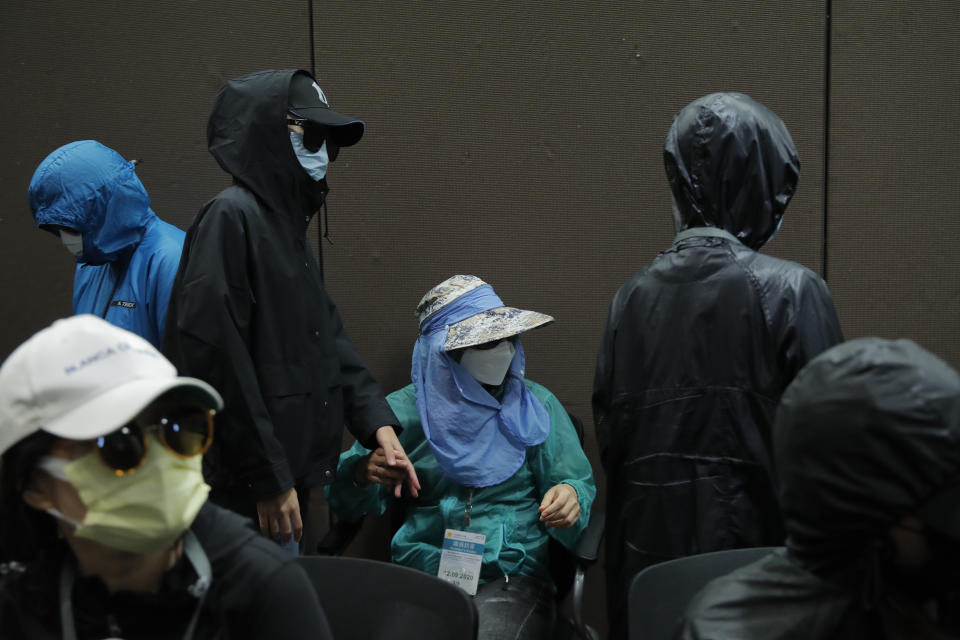Relatives of 12 Hong Kong activists detained at sea by Chinese authorities attend a press conference in Hong Kong, Saturday, Sept. 12, 2020. They called for their family members to be returned to the territory, saying their legal rights were being violated. (AP Photo/Kin Cheung)