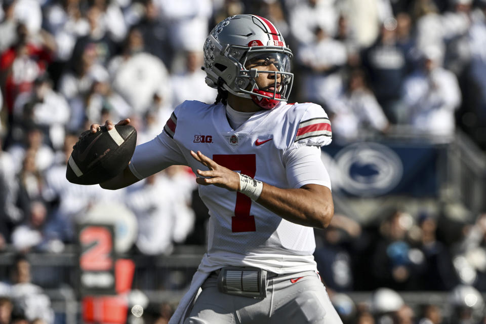 Ohio State quarterback C.J. Stroud (7) throws a pass against Penn State during the first half of an NCAA college football game, Saturday, Oct. 29, 2022, in State College, Pa. (AP Photo/Barry Reeger)