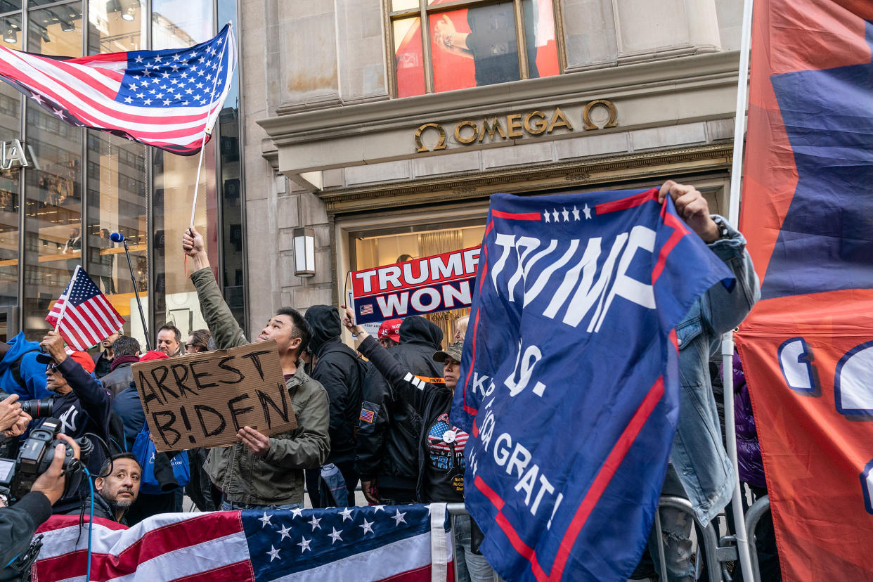 Supporters of Former President Donald Trump rally at Trump Tower in New York.