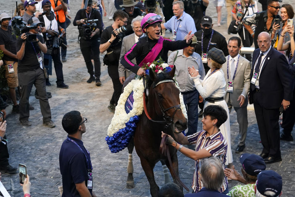 Jockey Junior Alvarado, aboard Art Collector, reacts in the winner's circle after winning the Pegasus World Cup Invitational horse race on the horse Art Collector, Saturday, Jan. 28, 2023, at Gulfstream Park in Hallandale Beach, Fla. (AP Photo/Lynne Sladky)